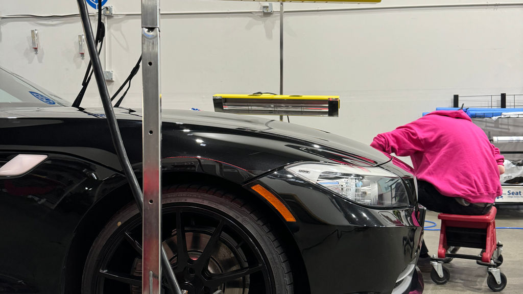 Infrared curing lamps used to cure a ceramic coating at APC Auto Spa